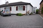 AFTER: New driveway installed using granite paving with contrasting colour band